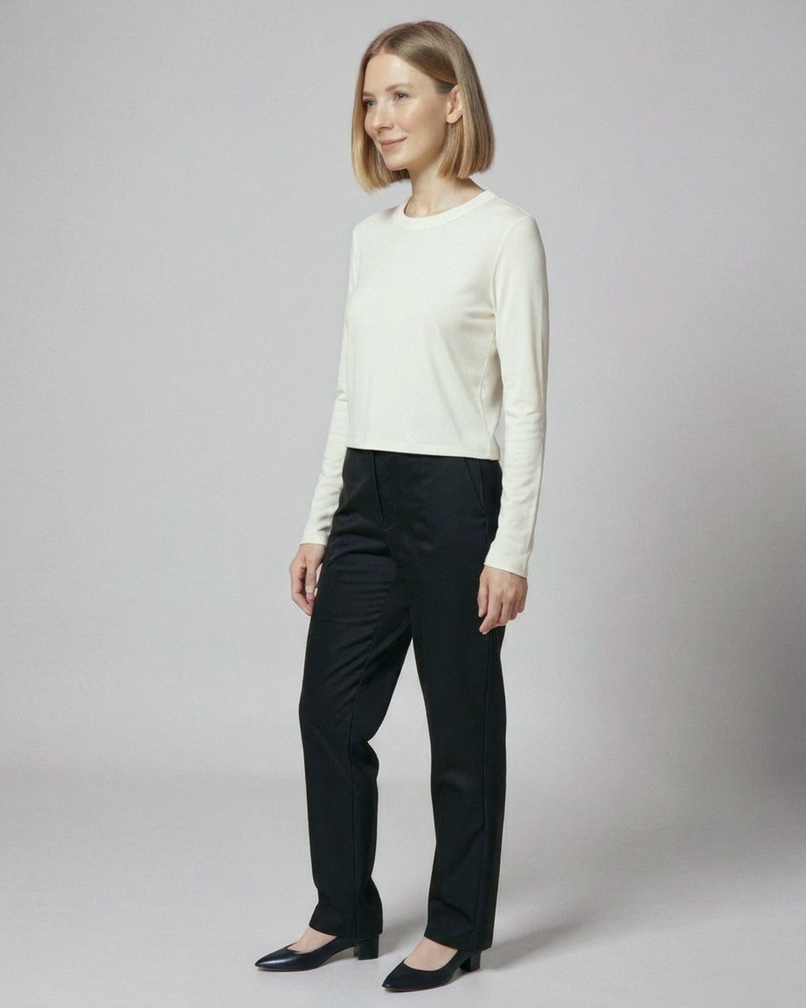 Astrid · Brushed crew-neck long-sleeve tee — on model, three-quarter (AI visualisation)