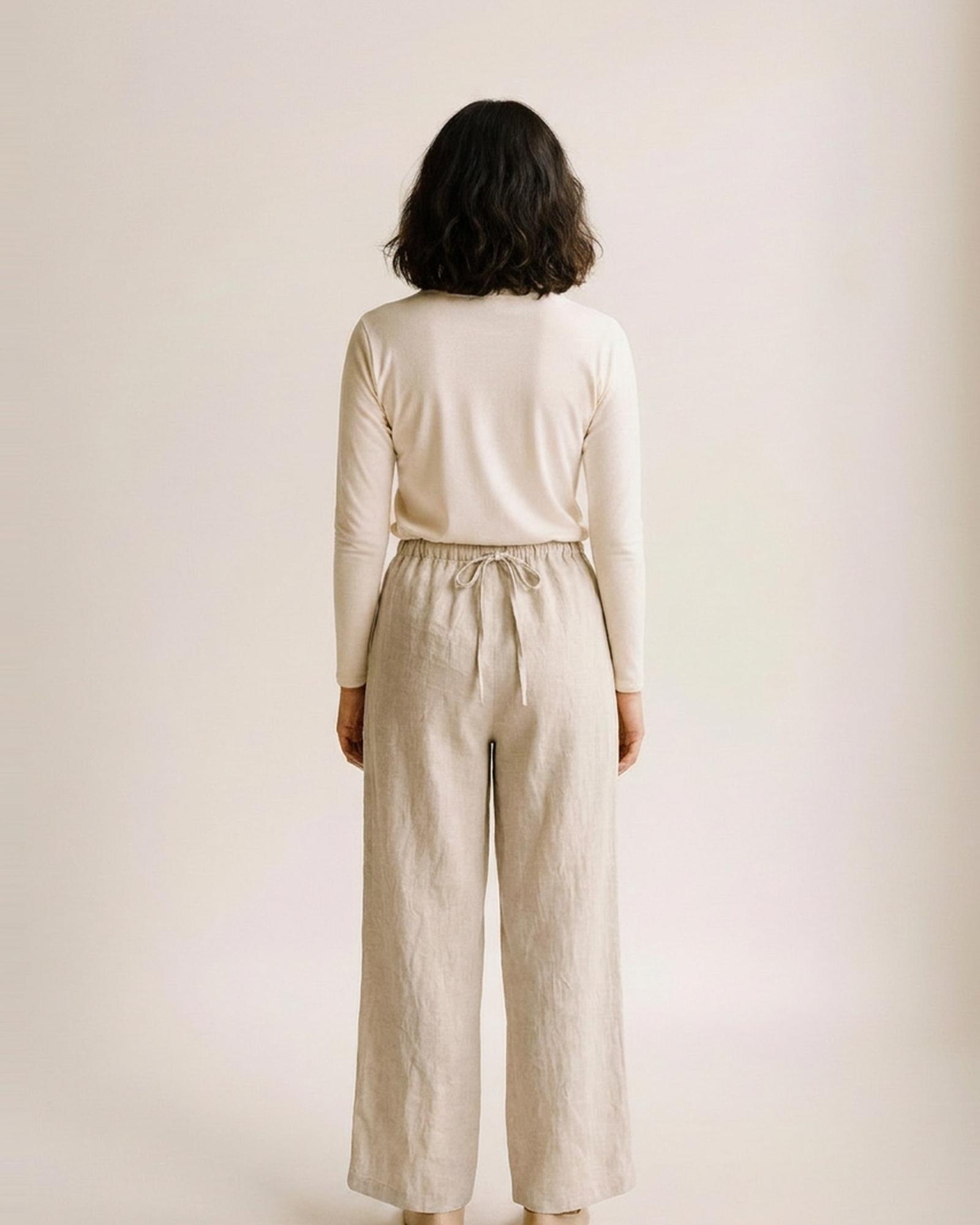 Bregtje beige linen drawstring wide-leg trousers — model back view (AI visualisation)