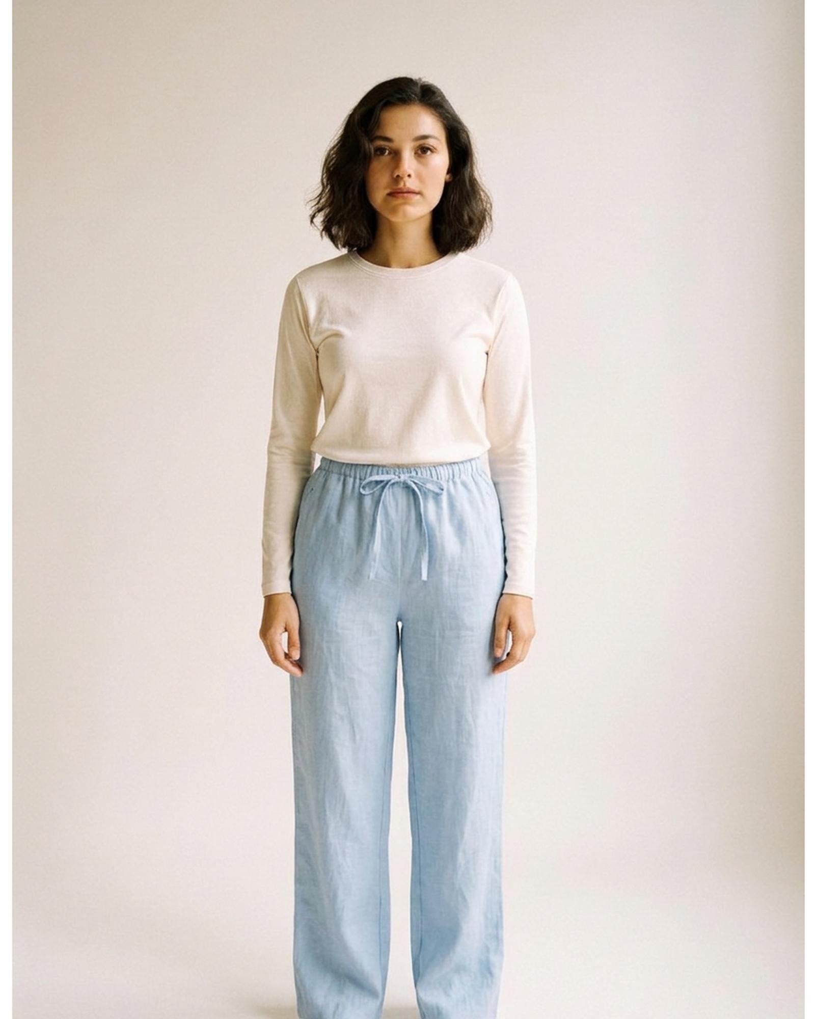 Bregtje · High-waist linen wide-leg trousers — sea blue, worn front (AI visualisation)