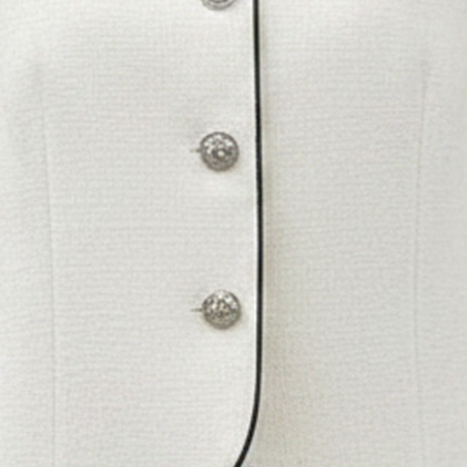 Carlijn cropped tweed jacket — silver buttons, black trim and tweed texture detail (AI visualisation)