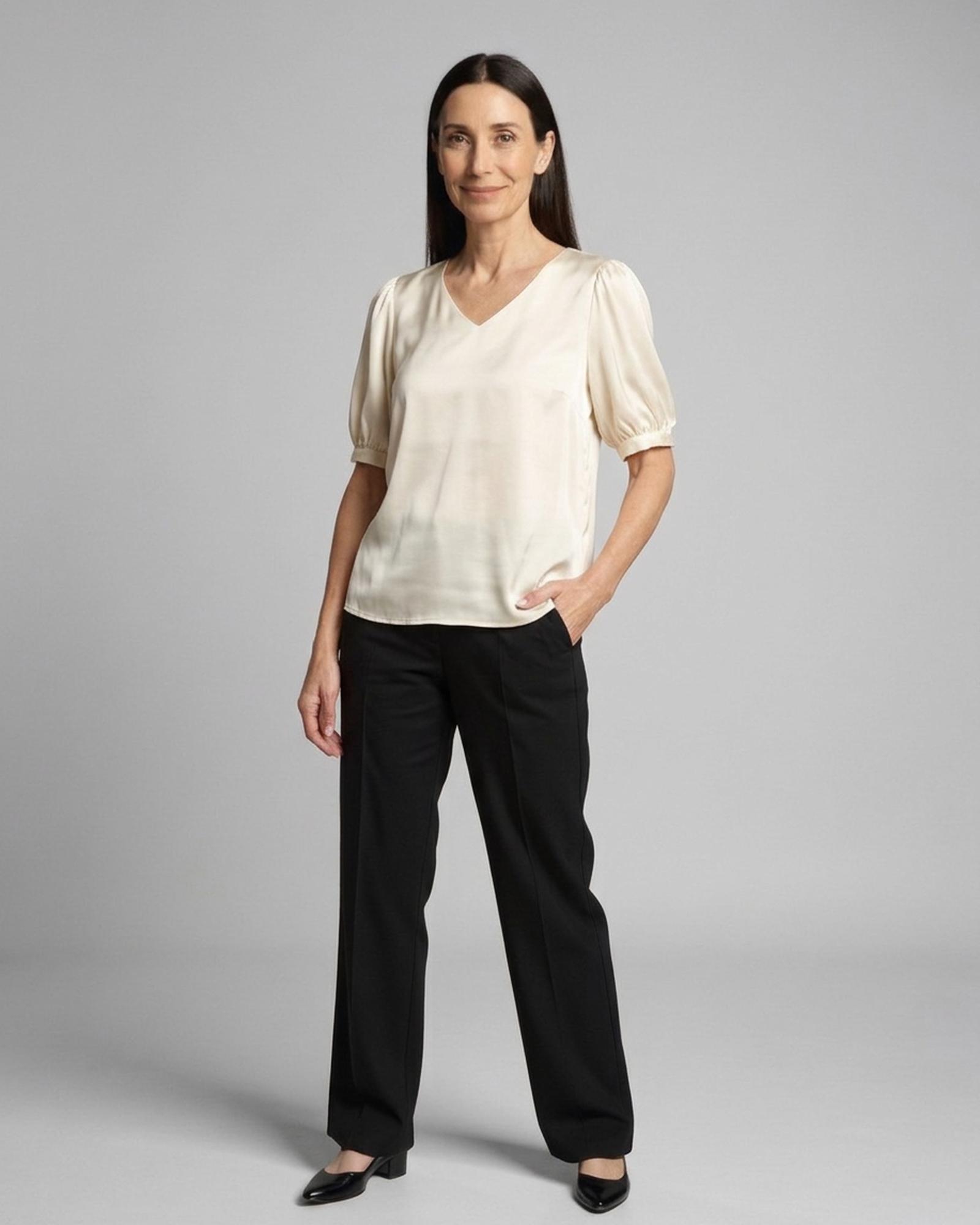 Corinne · Puff-sleeve satin blouse — on model, front (AI visualisation)