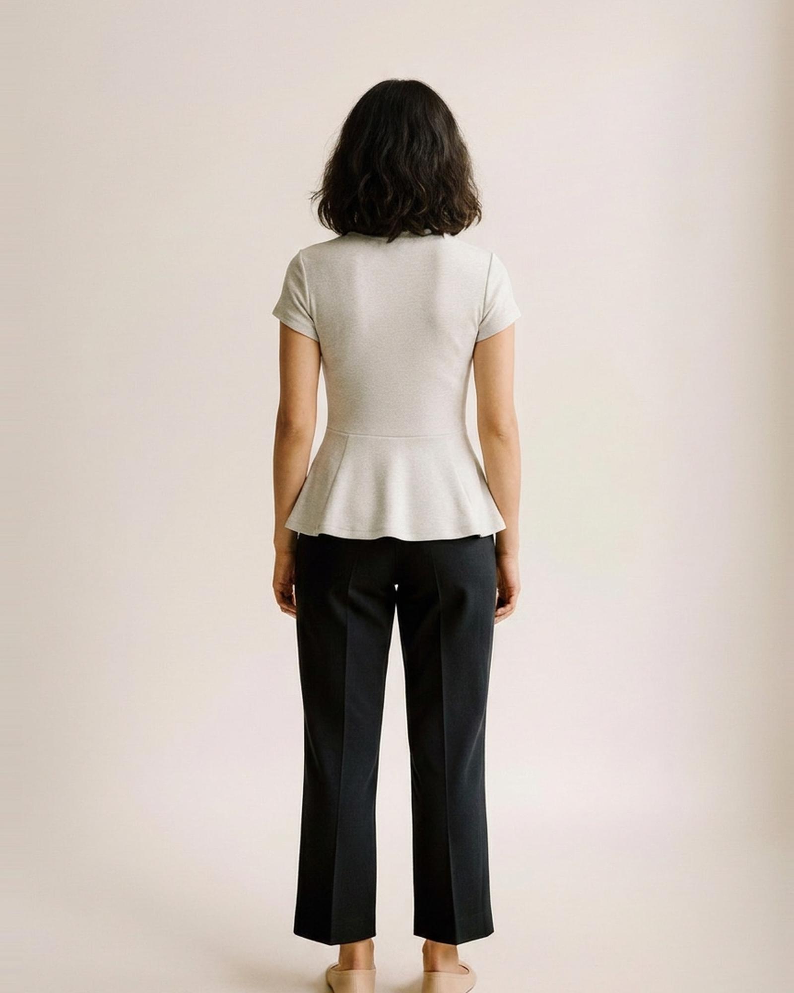 Eline · Round-neck short-sleeve cotton tee — on model, back (AI visualisation)