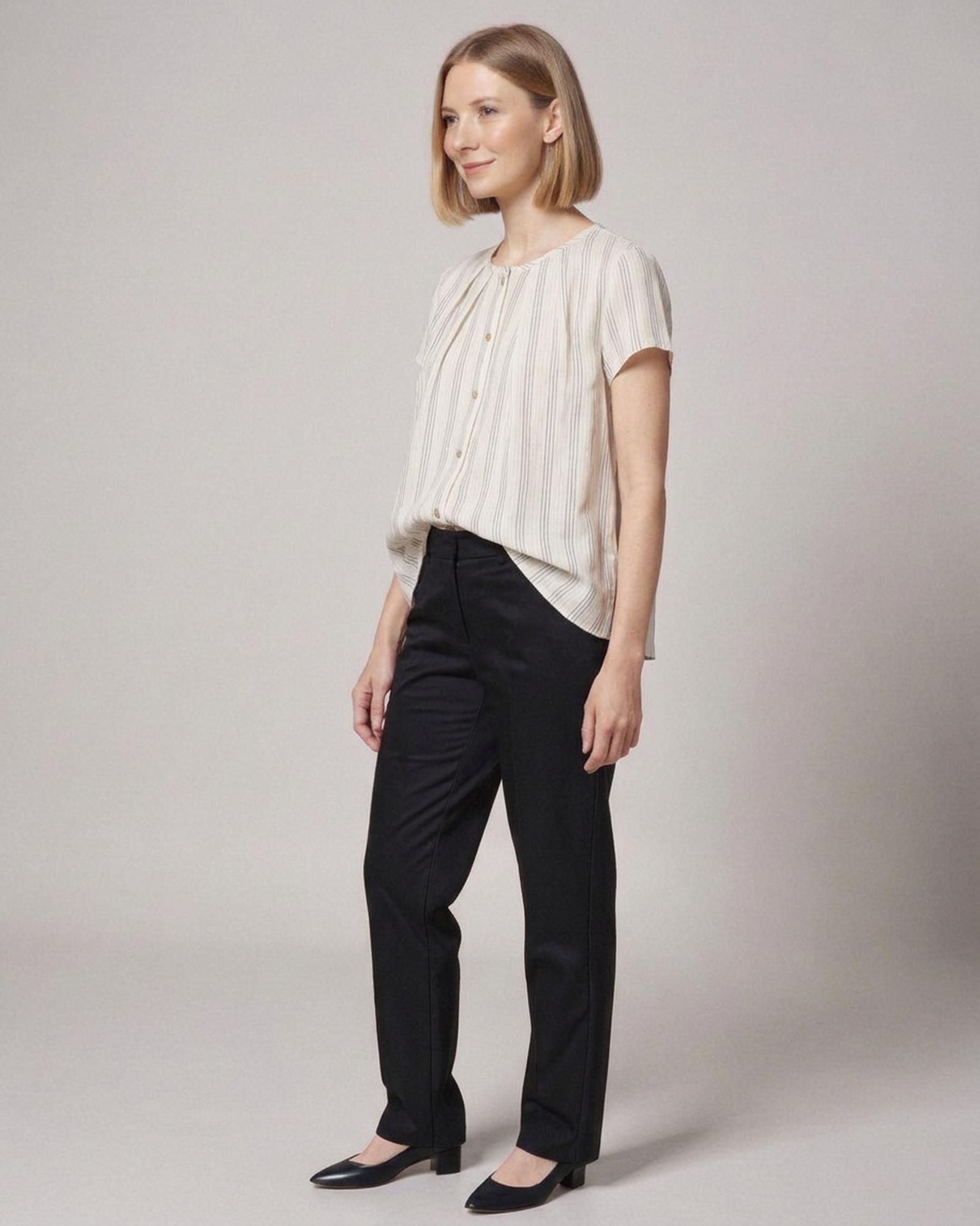 Gerda · Striped cotton-linen blouse — on model, three-quarter (AI visualisation)