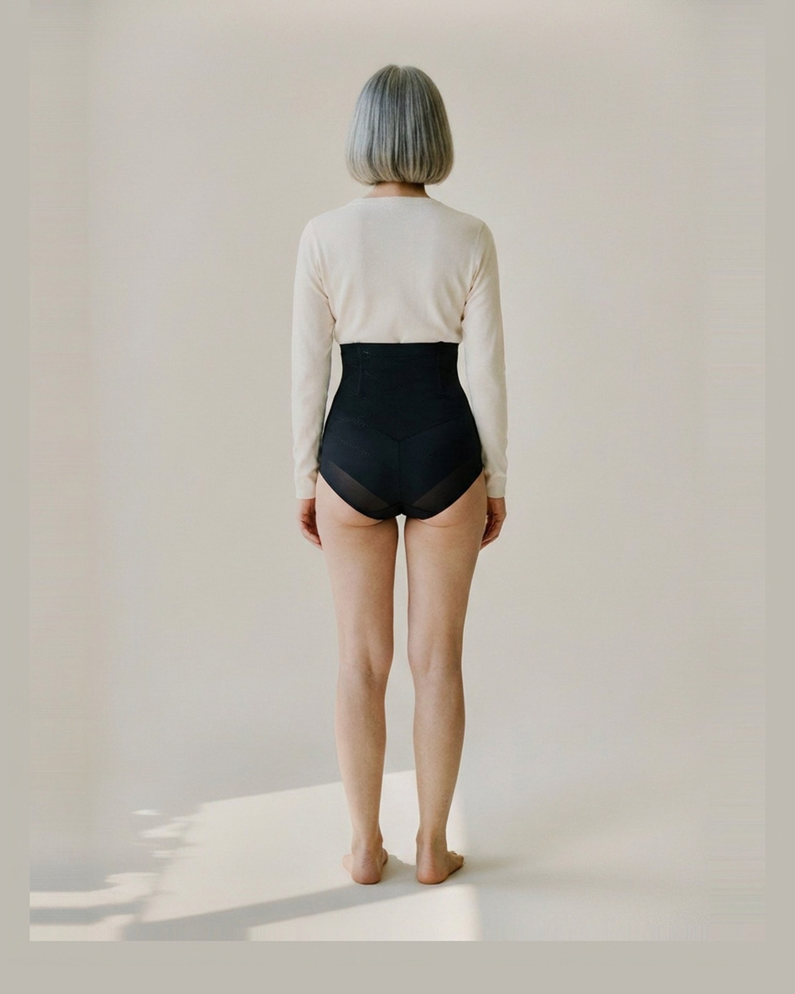 Guurtje · High-waist shaping brief — worn on model, back view (AI visualisation)