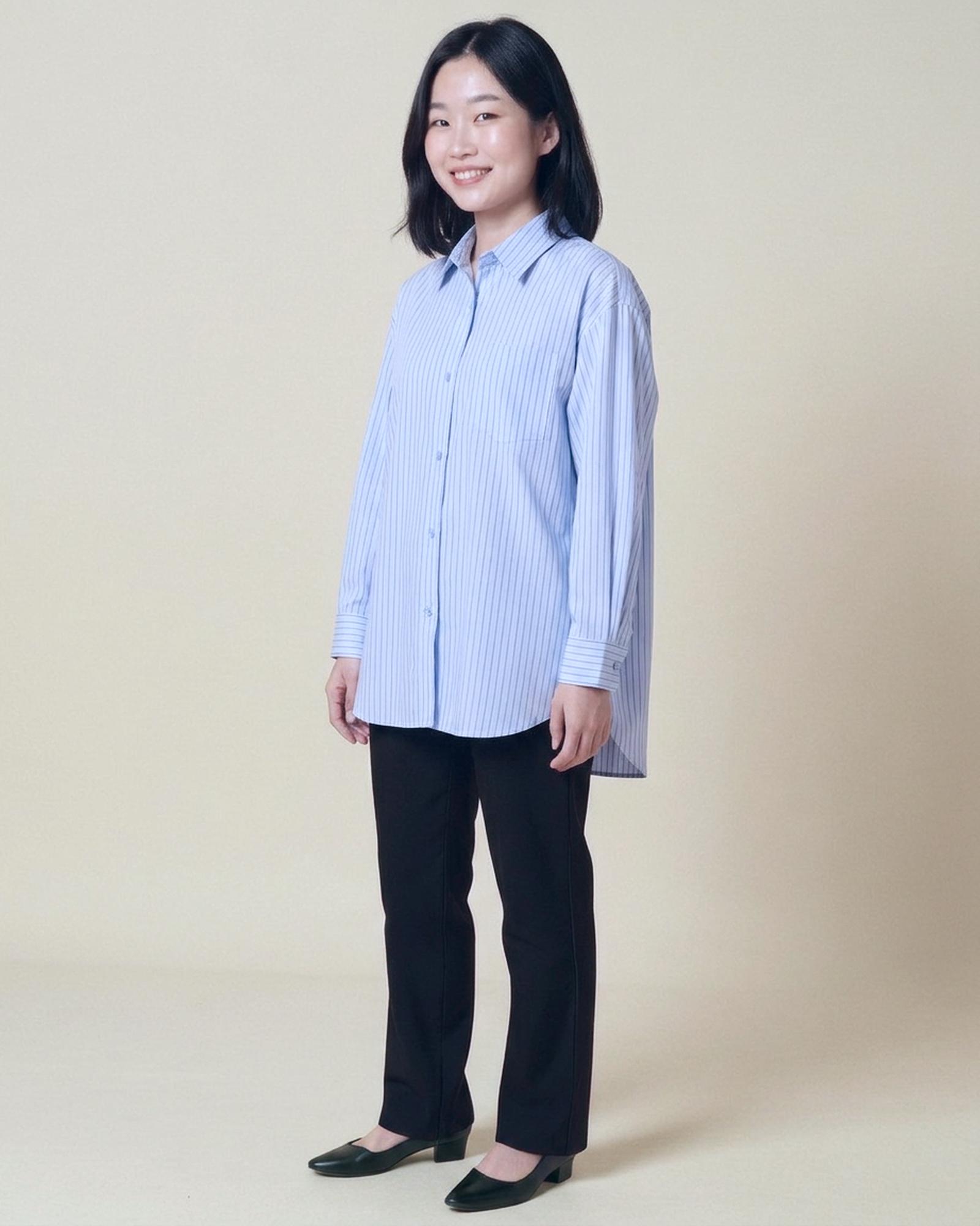 Ineke · Striped shirt blouse — on model, three-quarter (AI visualisation)