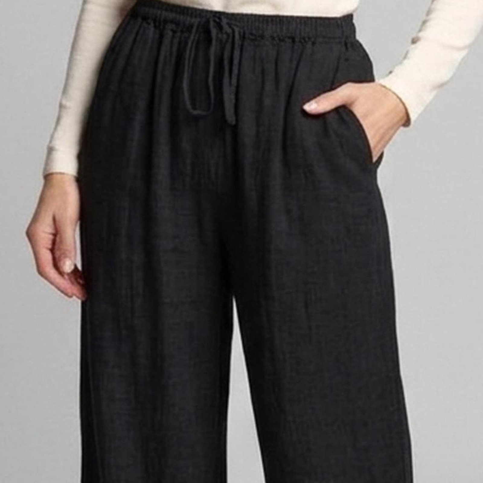 Janneke black linen trousers — drawstring waist, side pocket and linen weave detail — product photo