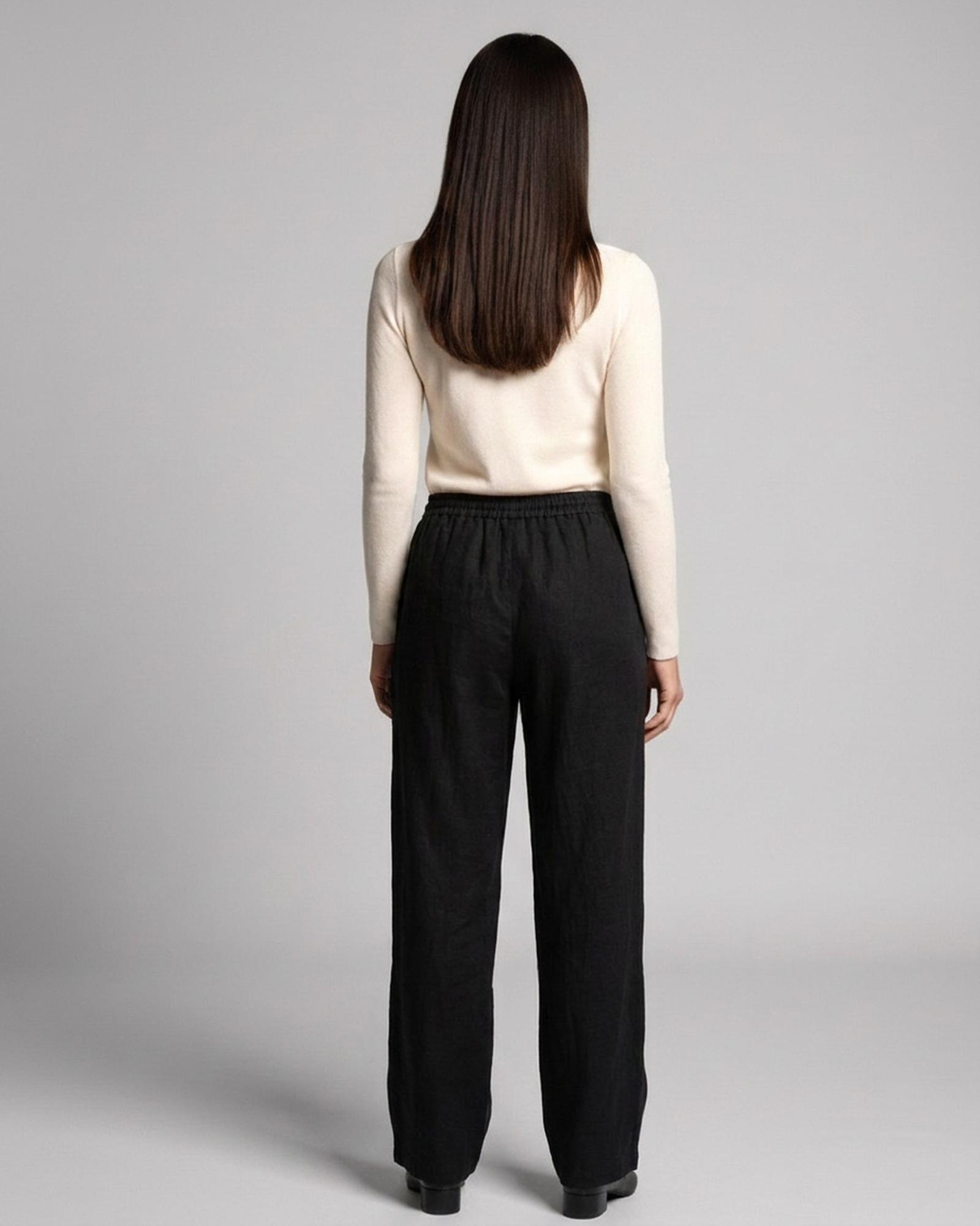 Janneke black loose wide-leg linen trousers — model back view (AI visualisation)