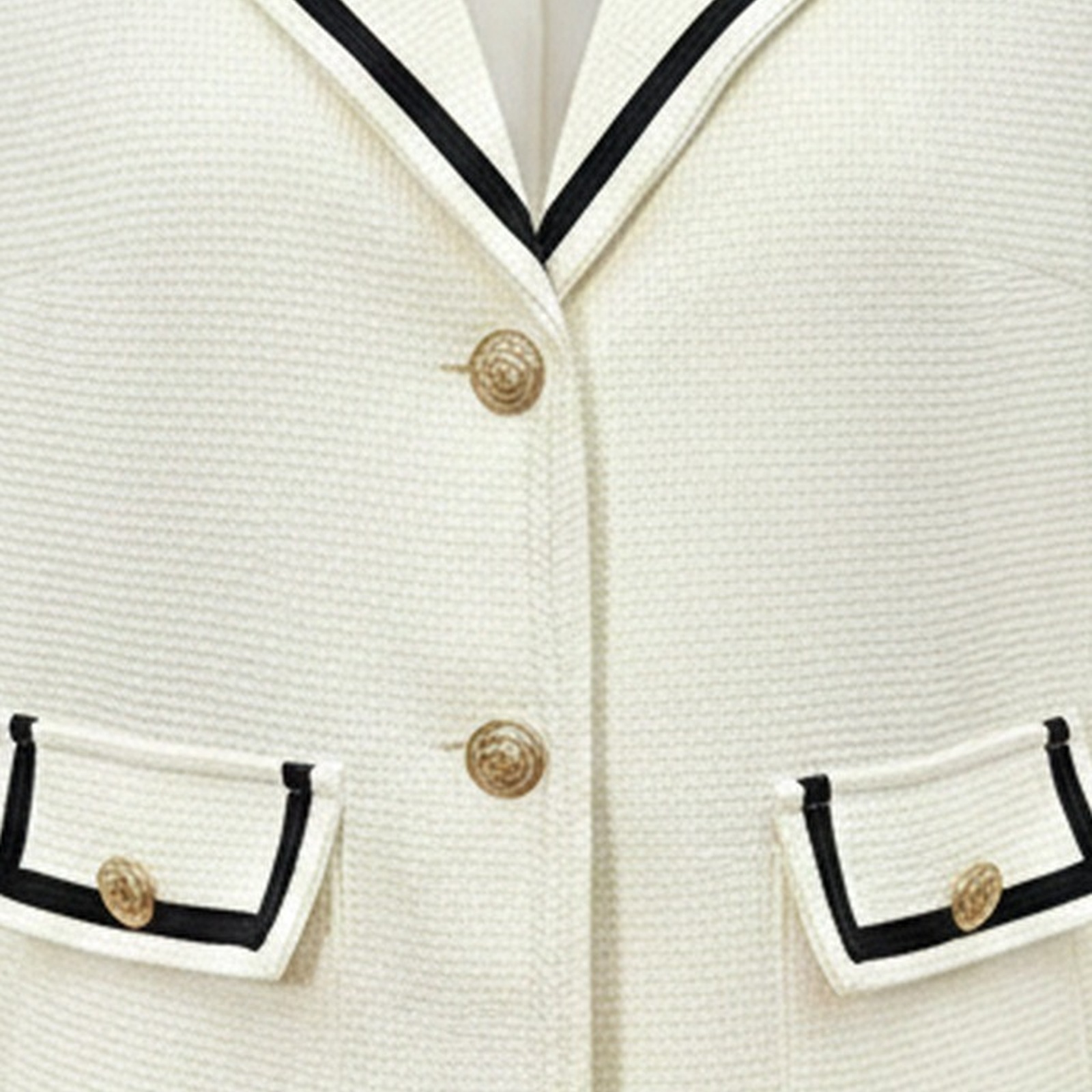 Jozefien cropped tweed jacket — black trim, gold buttons and tweed texture detail (AI visualisation)