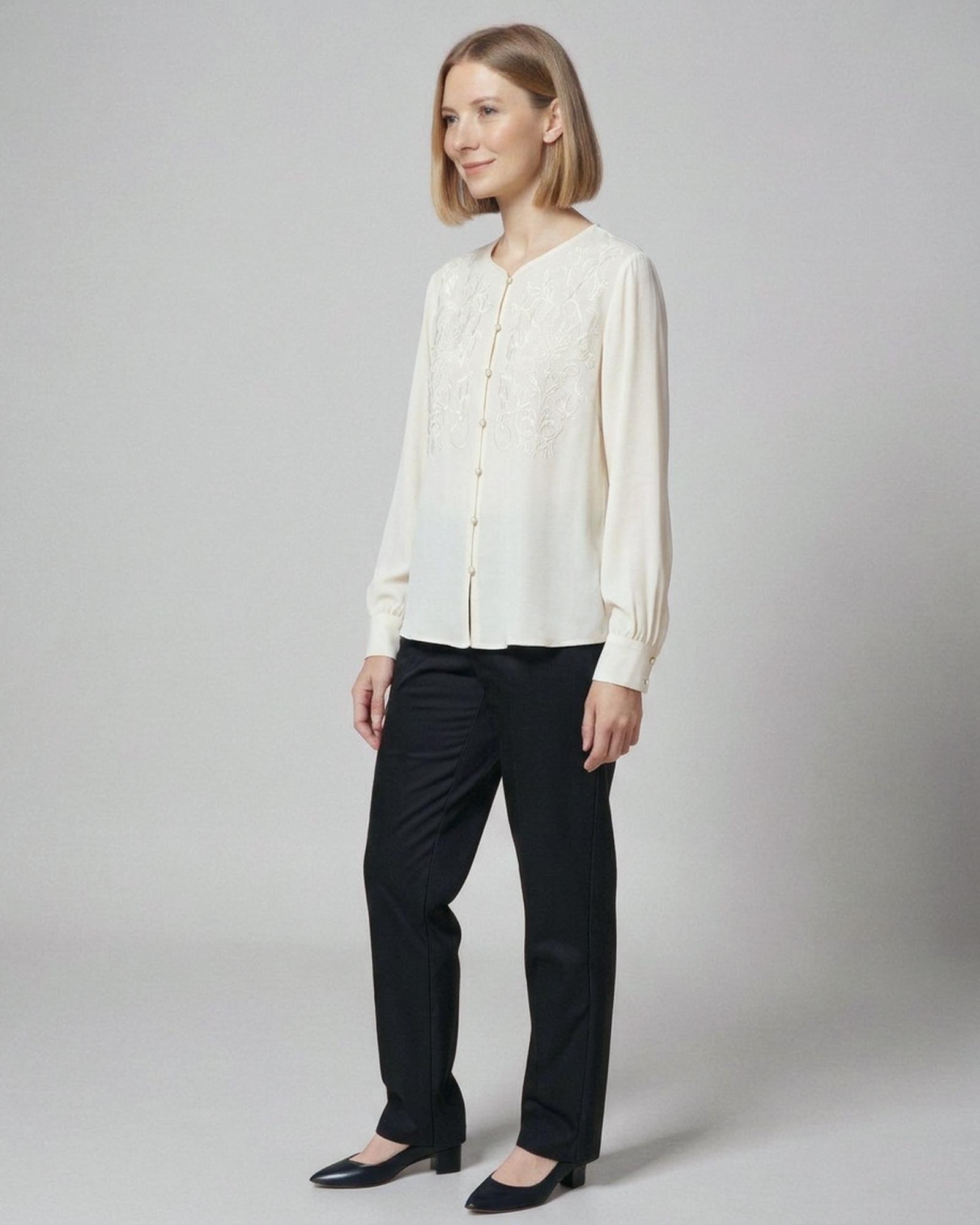 Meike · Embroidered chiffon blouse — on model, three-quarter (AI visualisation)
