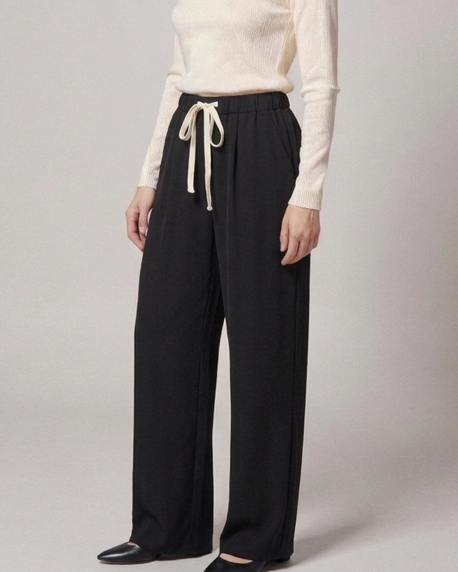 Noortje · Drawstring wide-leg trousers — on the model, three-quarter view (AI visualisation)
