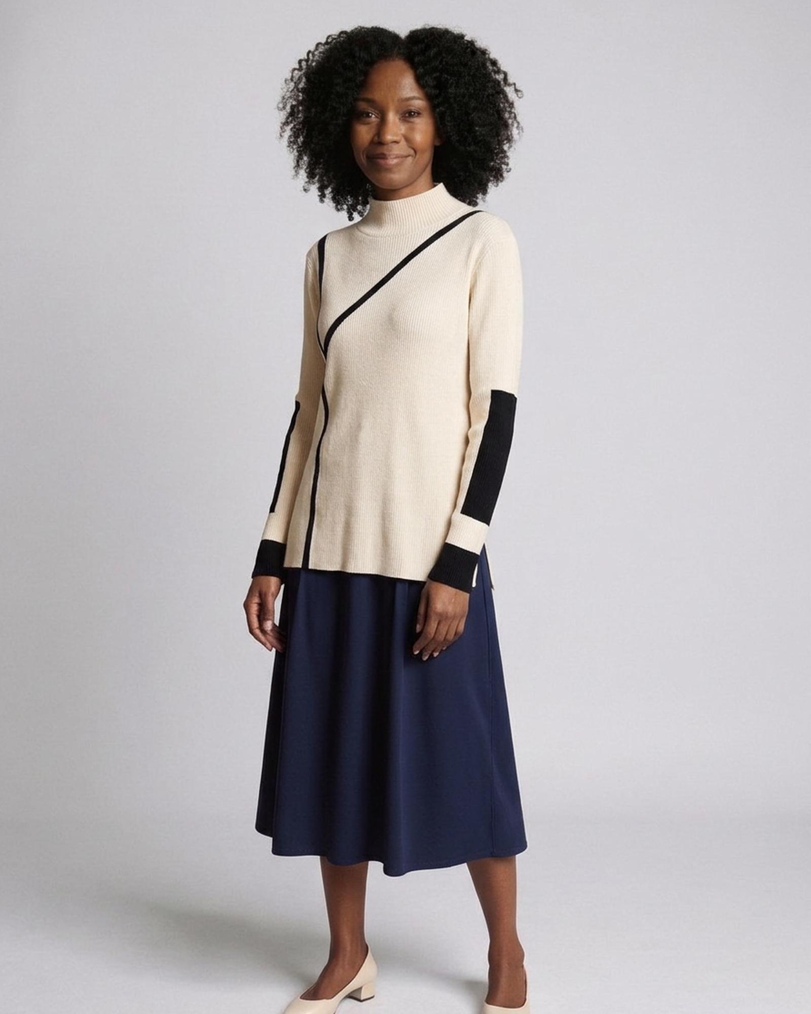 Rie beige ribbed mock-neck jumper with a diagonal black contrast band and black cuff bands, three-quarter view (AI visualisation)