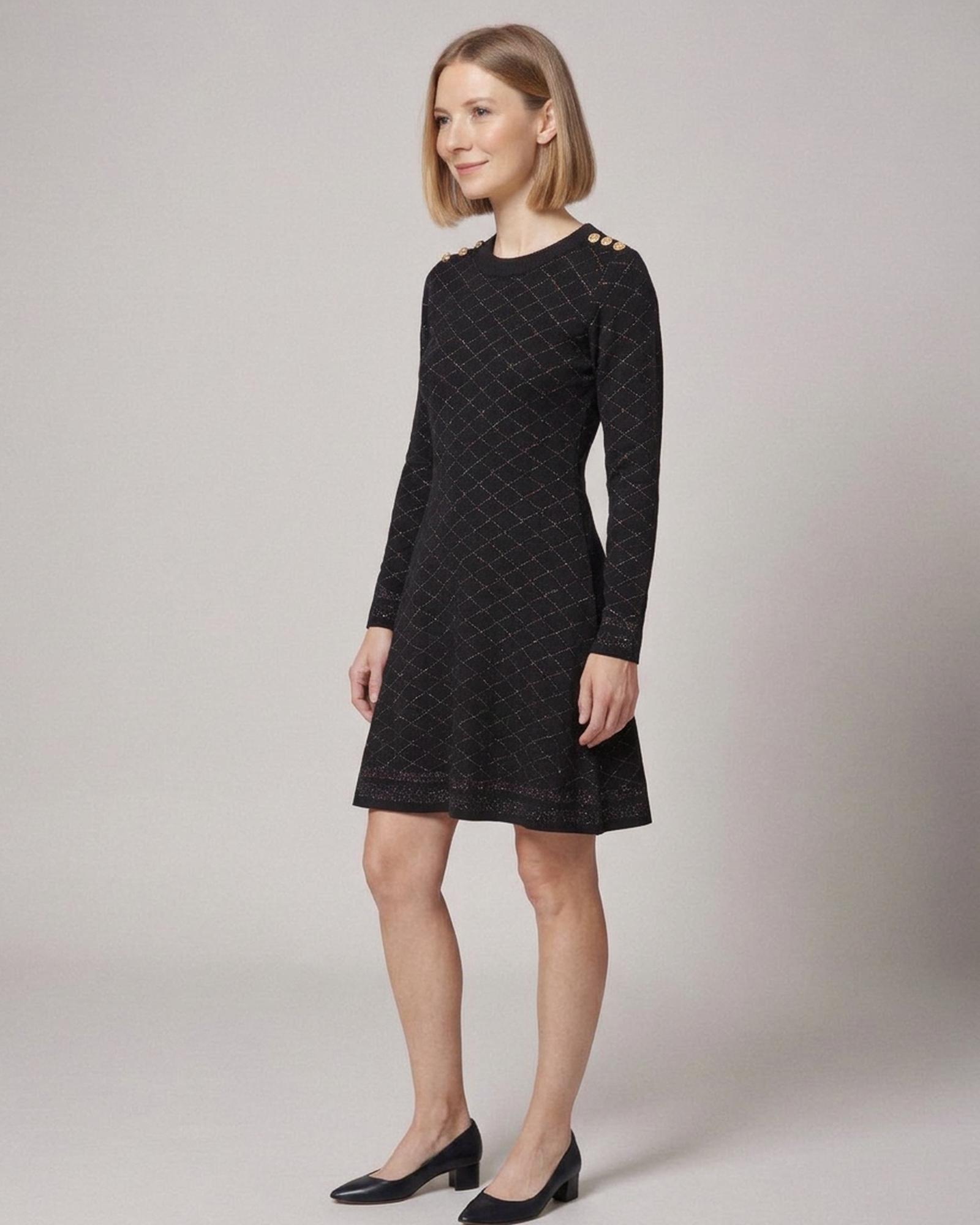 Rixt black knit A-line dress with diamond texture and gold shoulder buttons, three-quarter view (AI visualisation)