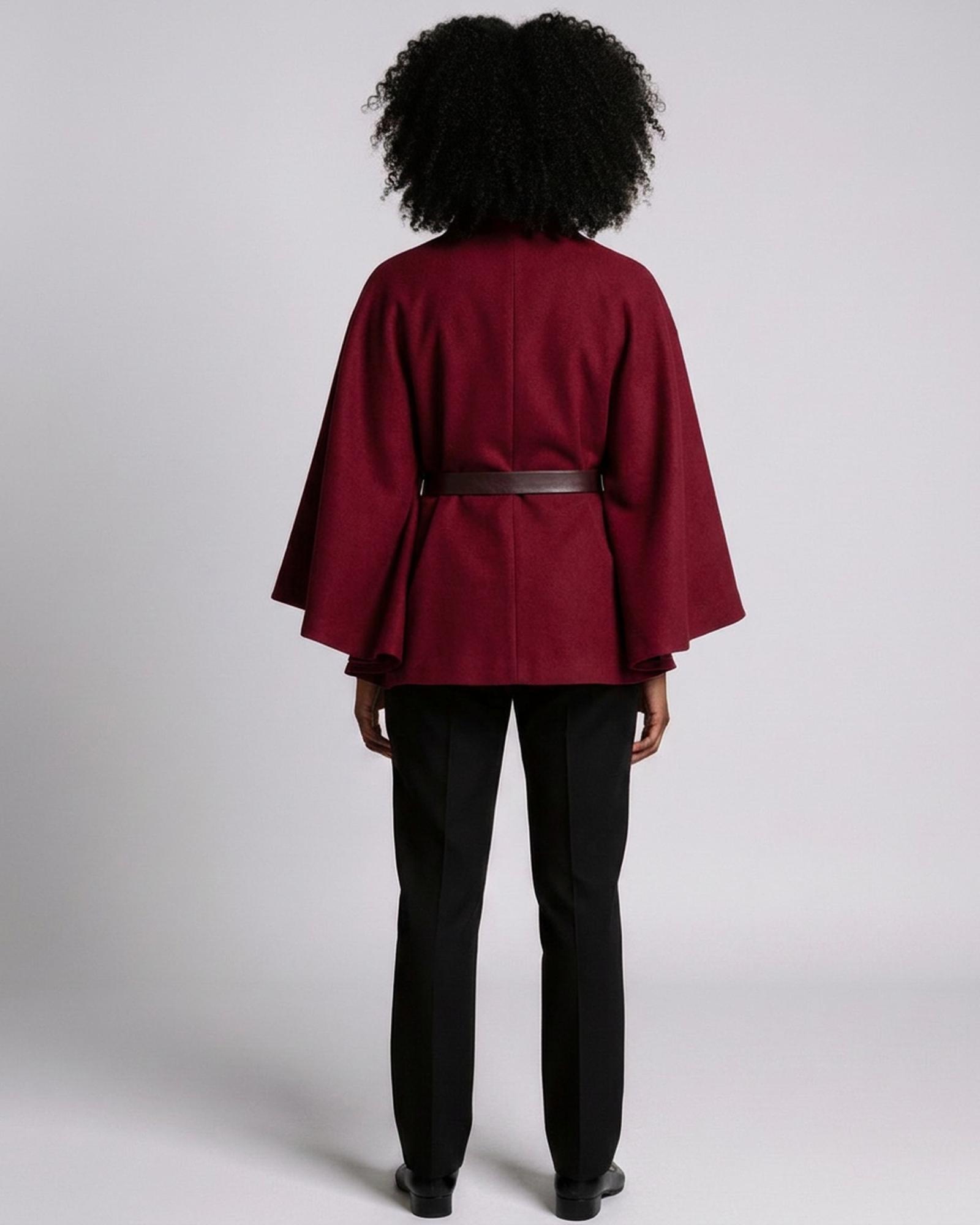 Sytske burgundy belted cape coat — model back view (AI visualisation)