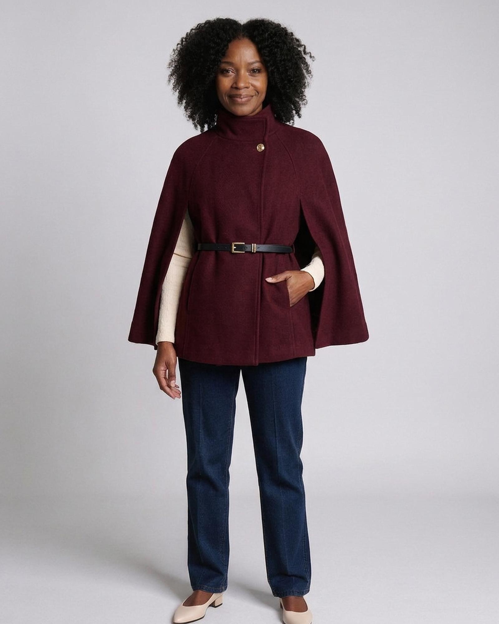 Sytske burgundy wool cape coat with high funnel collar and thin waist belt, three-quarter view (AI visualisation)