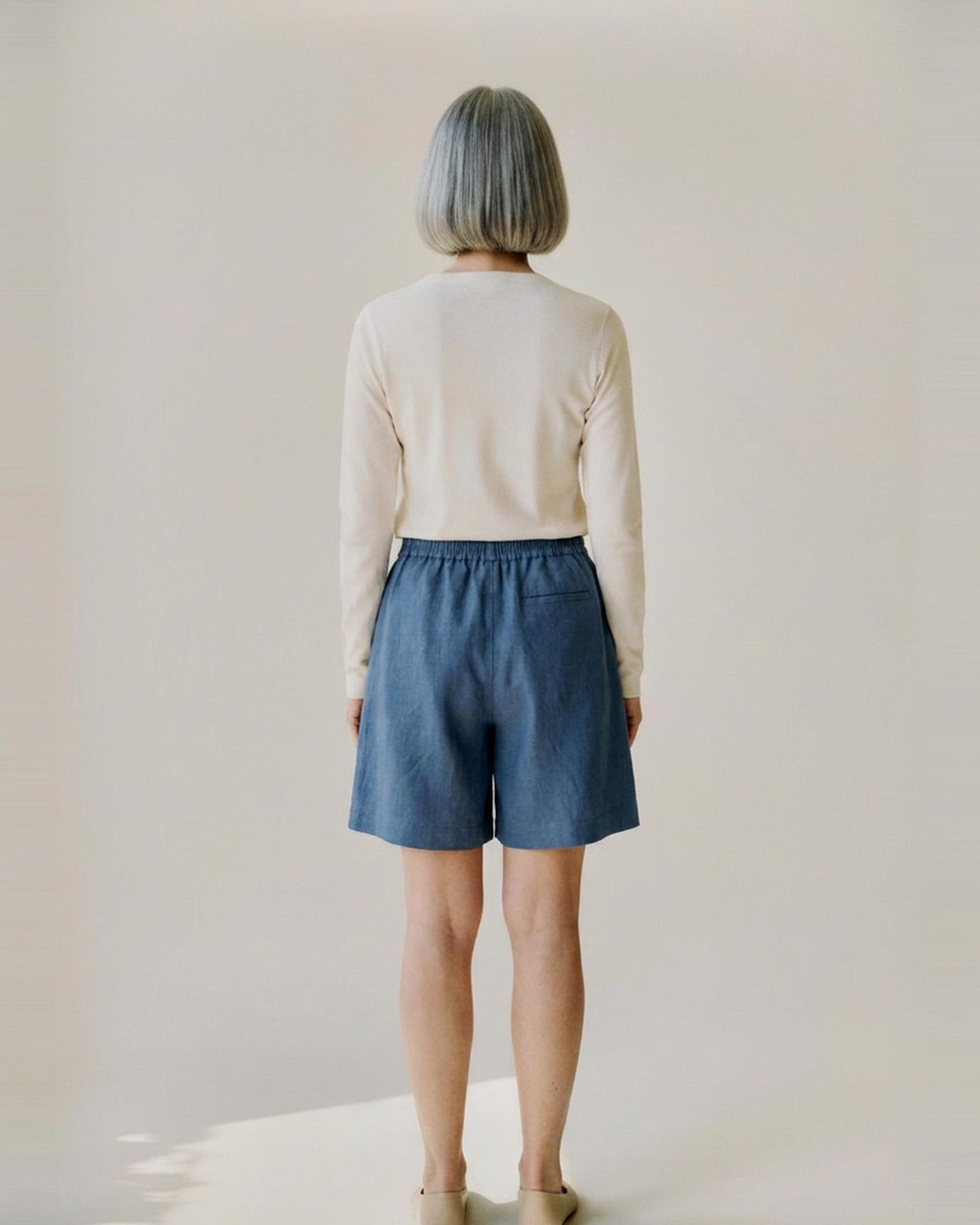 Tjitske · Washed linen wide-leg shorts — on model, back (AI visualisation)