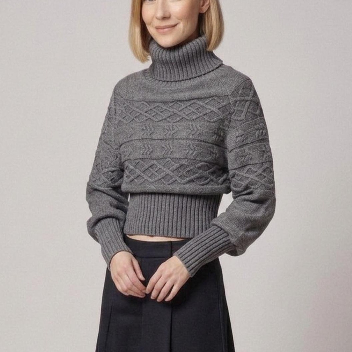 Wieteke grey chunky cable-knit turtleneck jumper with ribbed high neck, balloon sleeves and a ribbed waist, detail view (AI visualisation)