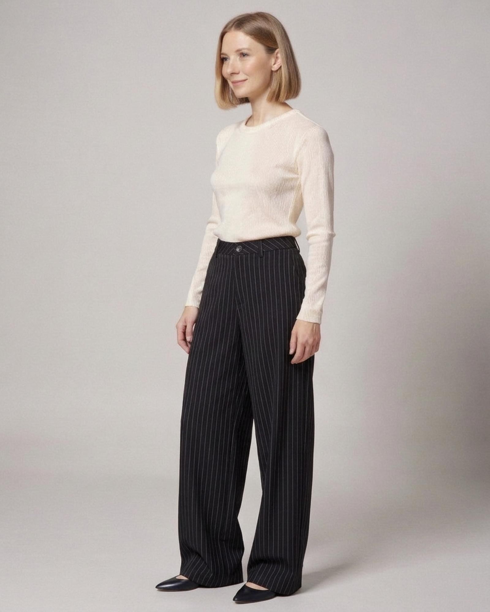 Wilma · Pinstripe suit trousers — black pinstripe, three-quarter view (AI visualisation)