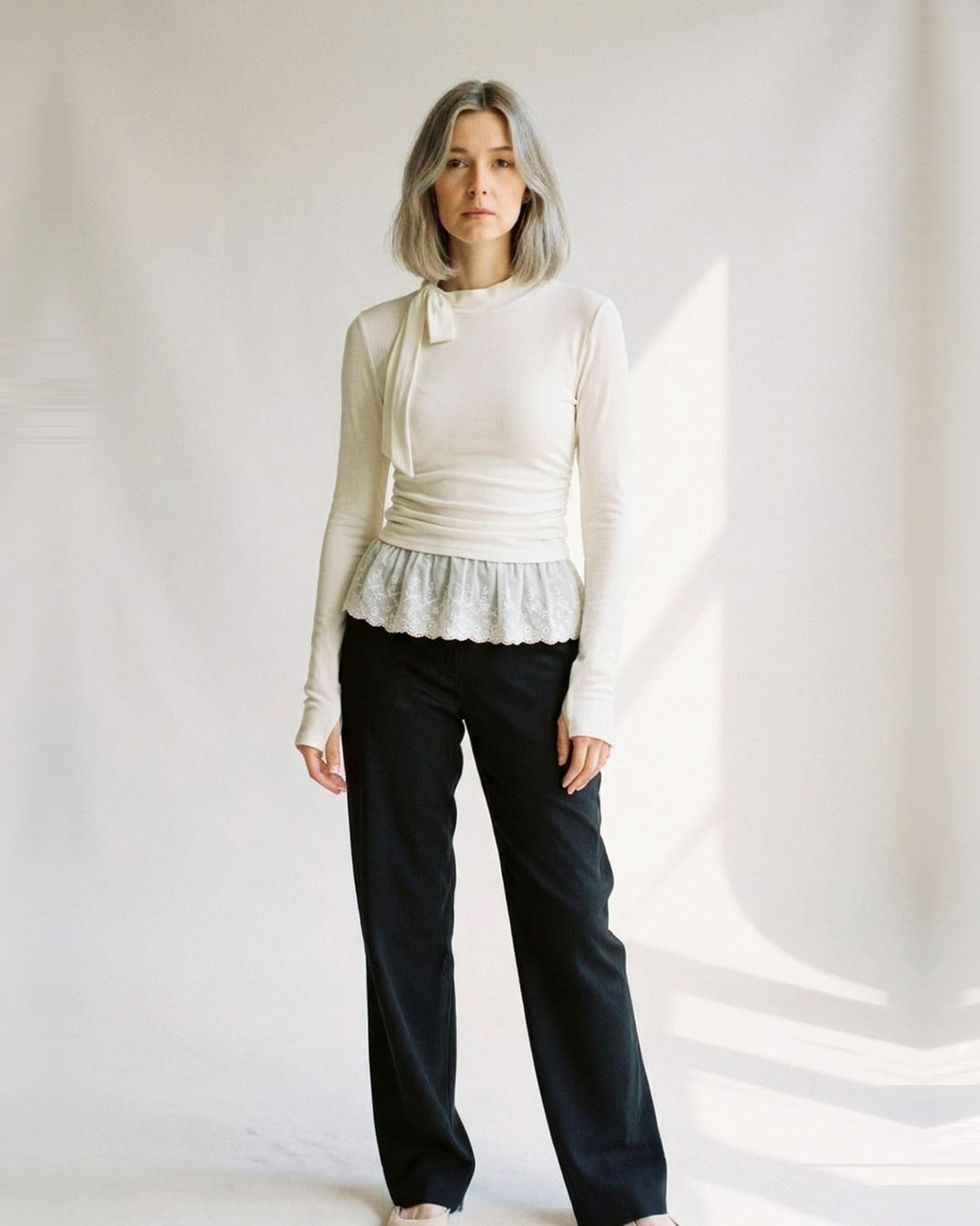 Annelies · High-neck long-sleeve top with lace detail — on model, front (AI visualisation)