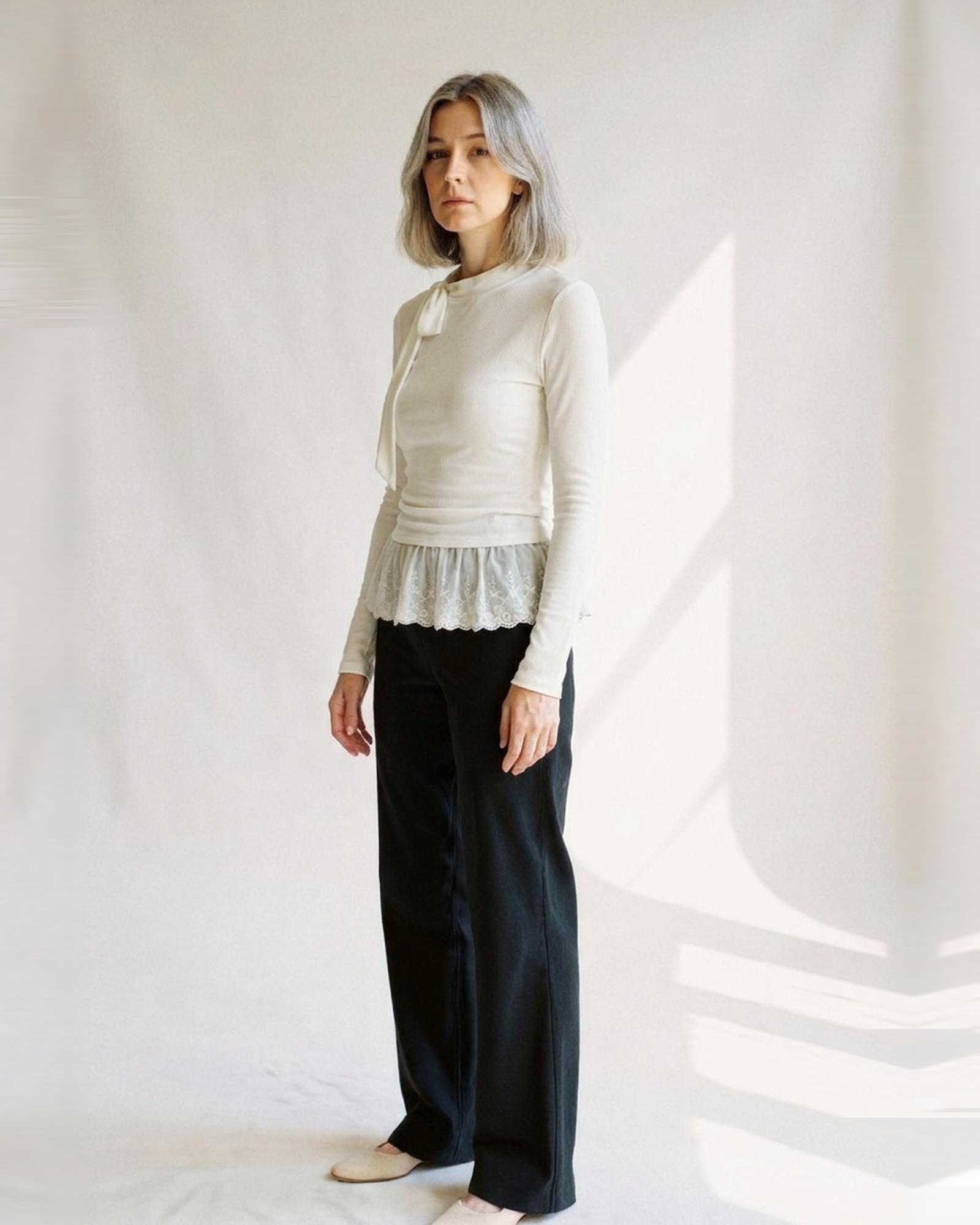 Annelies · High-neck long-sleeve top with lace detail — on model, three-quarter (AI visualisation)