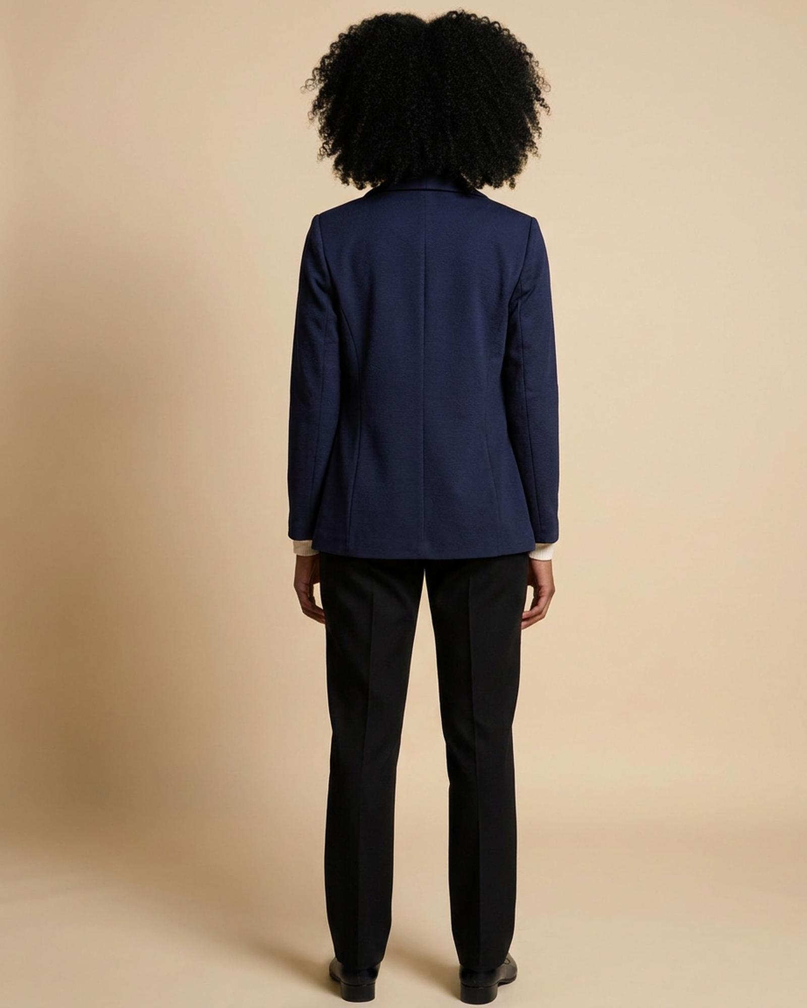 Navy blazer — back view on model (AI visualisation)