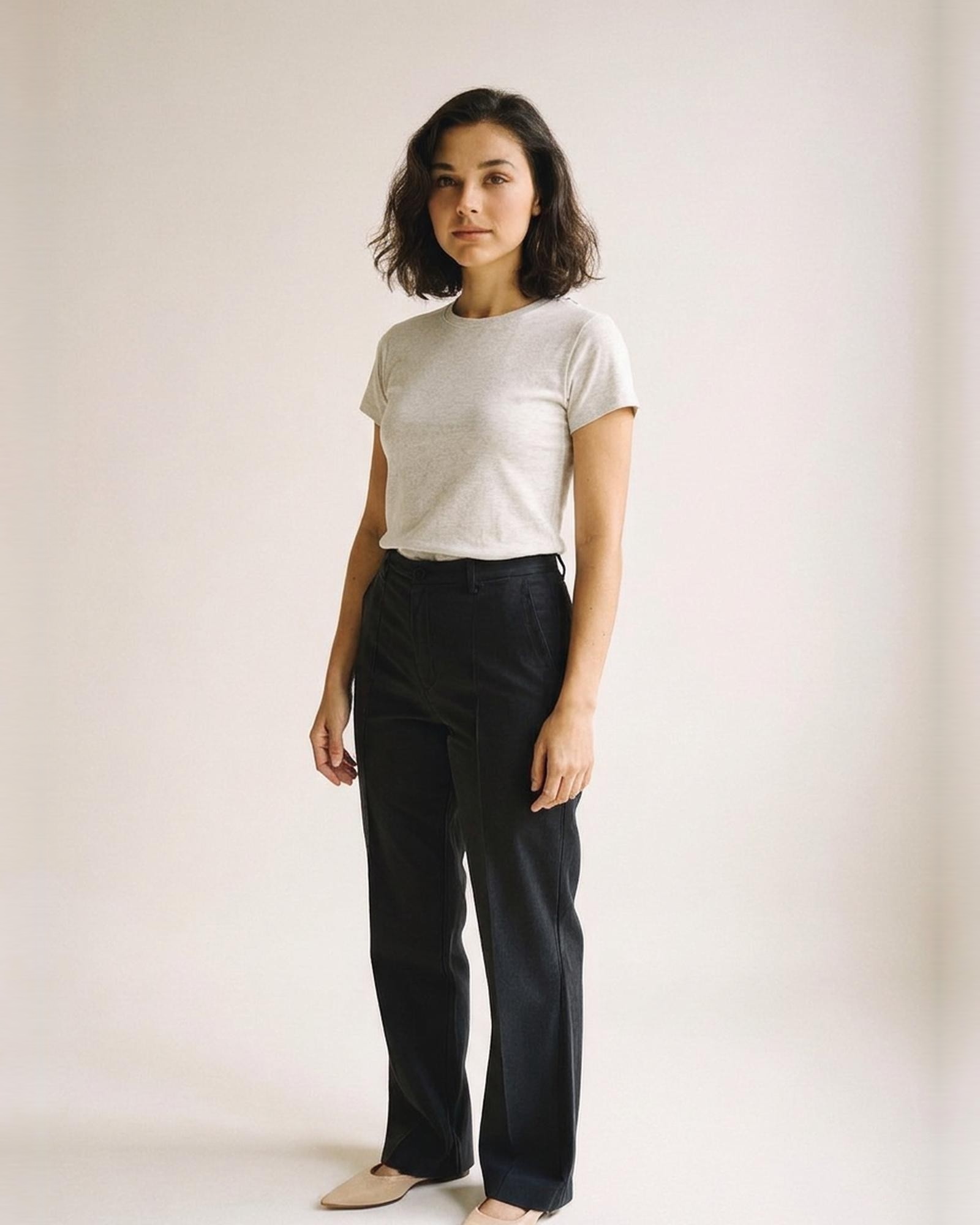 Eline · Round-neck short-sleeve cotton tee — on model, three-quarter (AI visualisation)