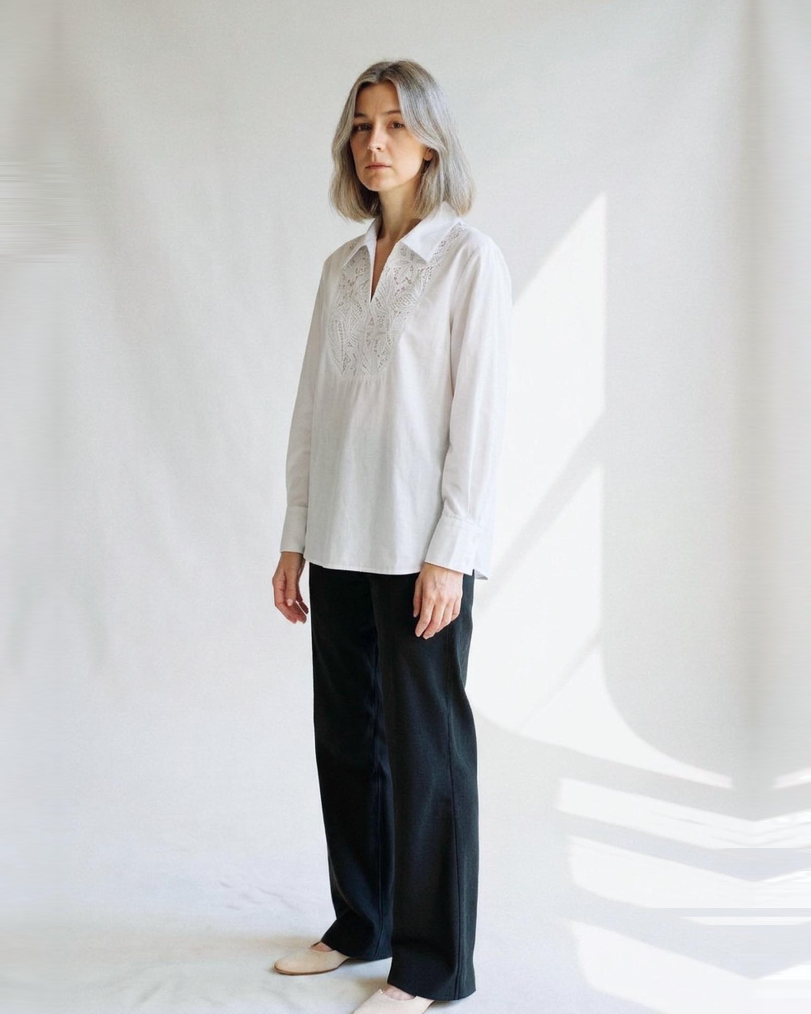 Hilde · Lace-panel white blouse — on model, three-quarter (AI visualisation)