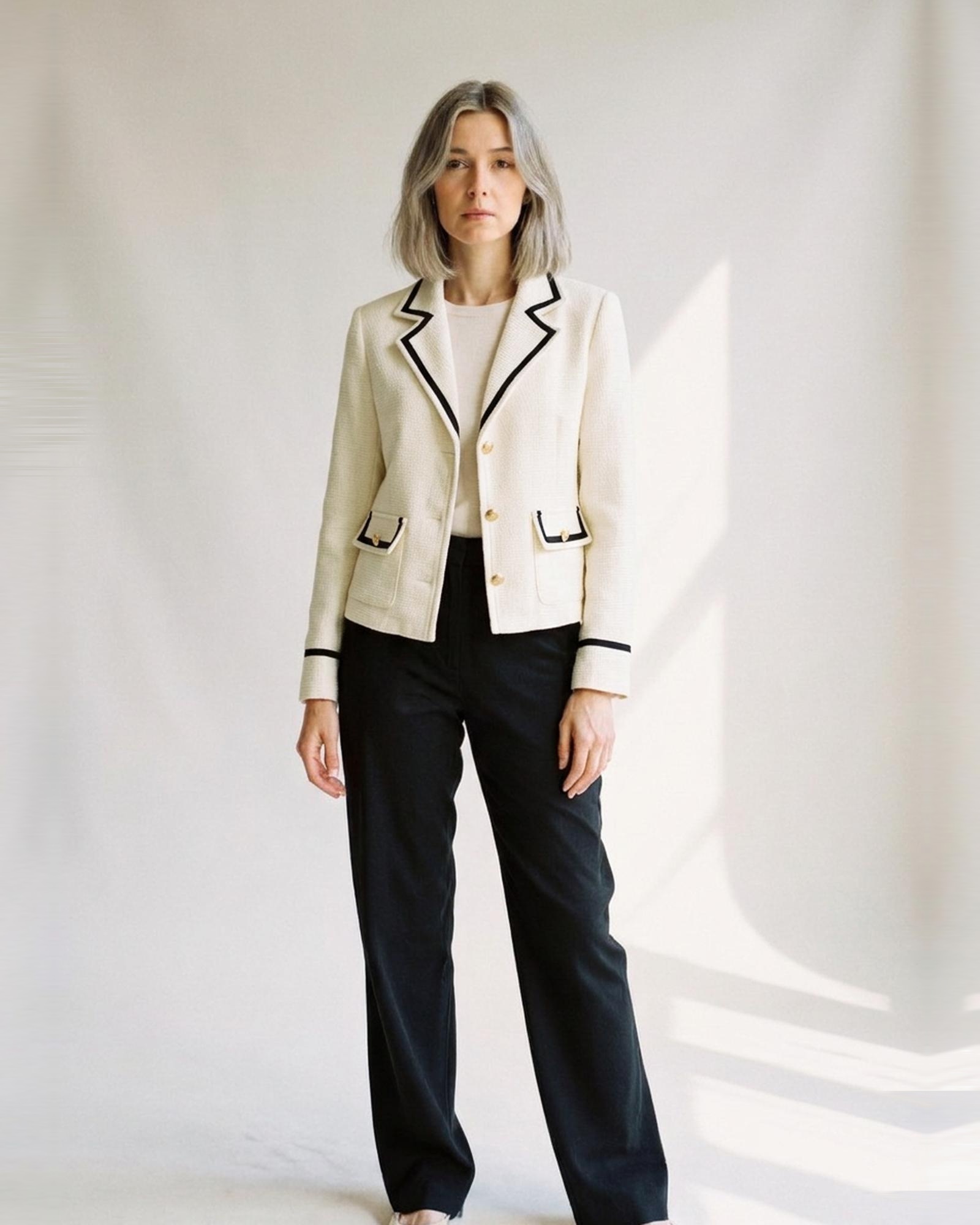 Jozefien cream and black colour-block tweed blazer with black trim and gold buttons, three-quarter view (AI visualisation)