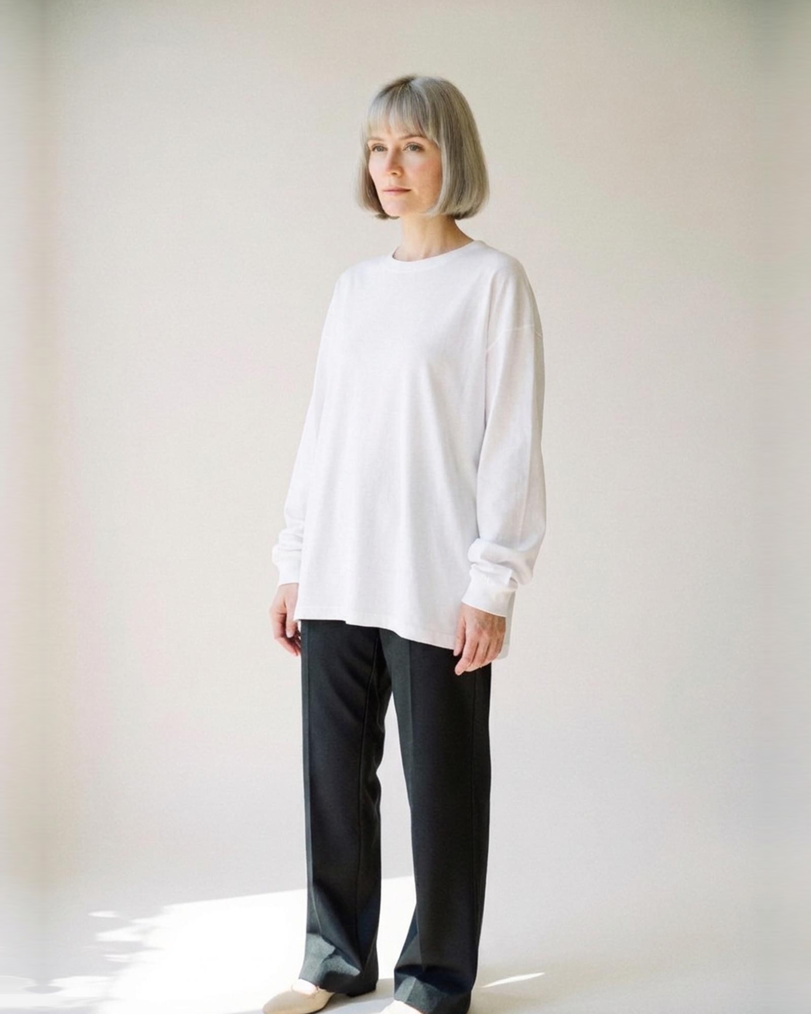 Marloes · Loose cotton long-sleeve tee — on model, three-quarter (AI visualisation)