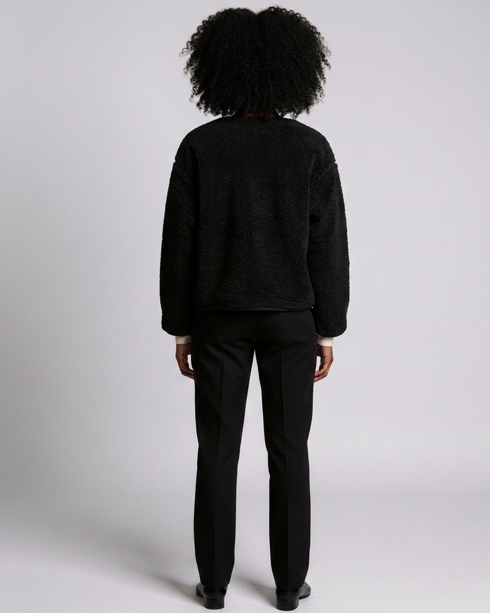 Teddy fleece jacket — back view on model (AI visualisation)