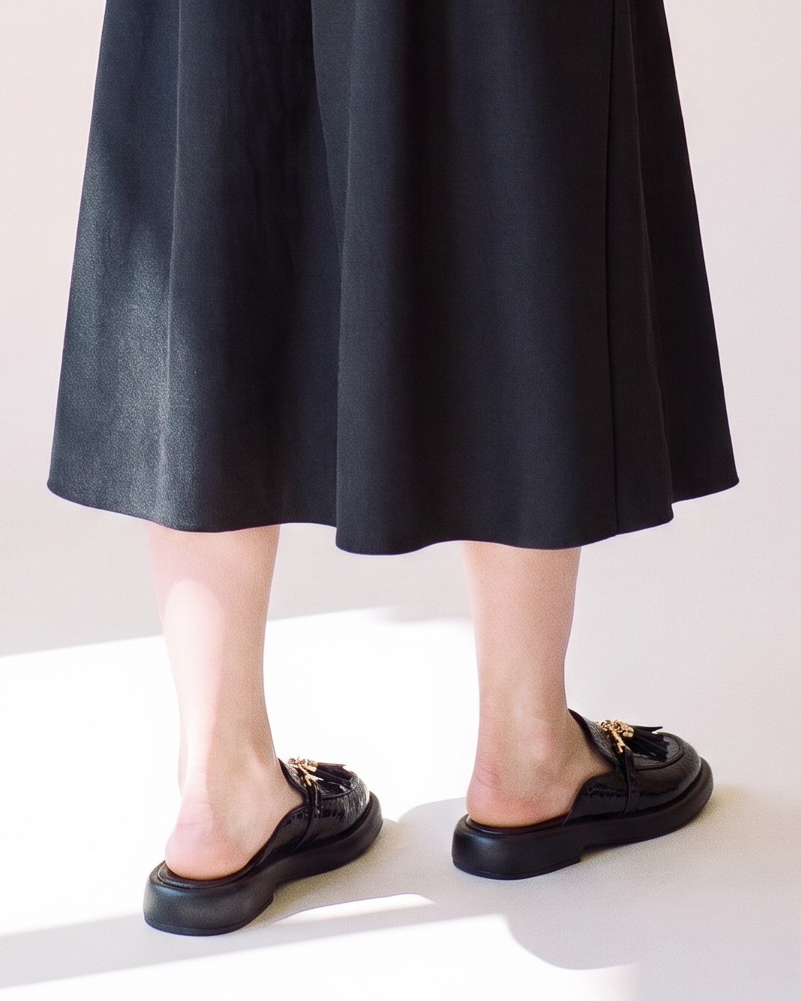 griselda croc effect tassel loafer mule — back view on model (AI visualisation)