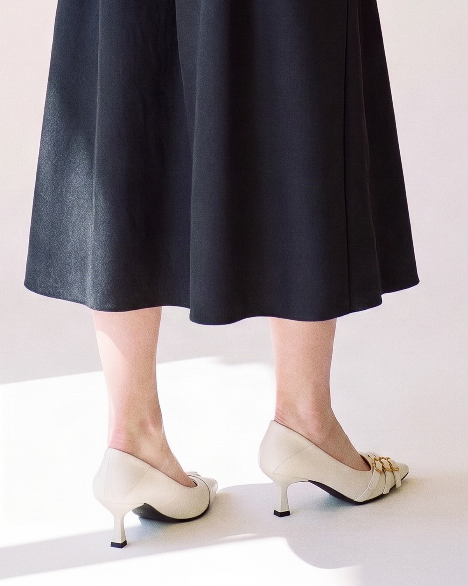 jantje pointed kitten heel pump — back view on model (AI visualisation)