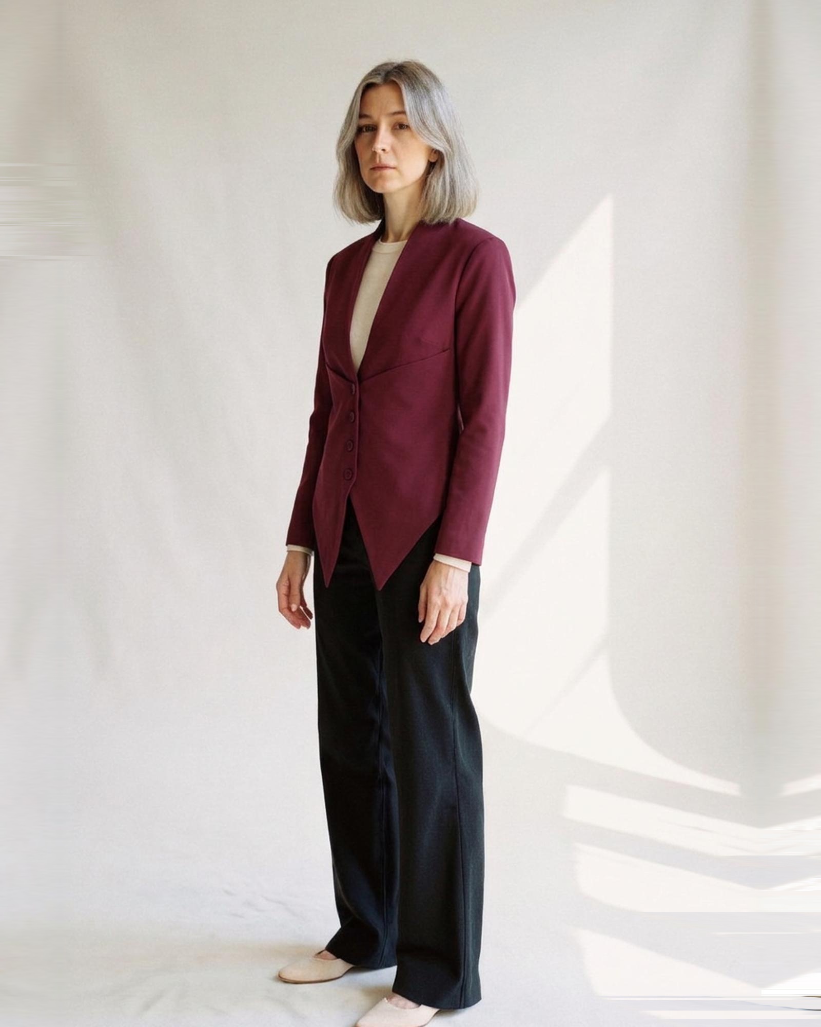 Petronella wine-red collarless slim-fit blazer coat with deep V neckline and fabric buttons, three-quarter view (AI visualisation)